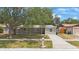 Charming single-story home with a well-maintained front yard and inviting covered porch at 9043 108Th Ave, Seminole, FL 33777