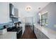 Bright kitchen with white cabinets, stainless steel appliances, and modern countertops at 9043 108Th Ave, Seminole, FL 33777