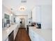 Bright kitchen with white cabinets, stainless steel appliances, and modern countertops at 9043 108Th Ave, Seminole, FL 33777