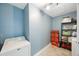 Efficient laundry room with a modern washer and dryer, plus ample storage shelving at 9043 108Th Ave, Seminole, FL 33777