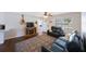 Cozy living room with a comfortable sofa, a decorative rug, and natural light at 9043 108Th Ave, Seminole, FL 33777