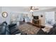 Comfortable living room with a sofa, a decorative rug, and an adjacent dining area and kitchen at 9043 108Th Ave, Seminole, FL 33777