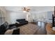 Comfortable living room with a sofa, a decorative rug, and an adjacent dining area at 9043 108Th Ave, Seminole, FL 33777