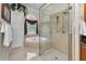Bathroom featuring a glass shower, soaking tub, and decorative fixtures at 9208 Brindlewood Dr, Odessa, FL 33556