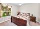 Bedroom with a ceiling fan, a window, and neutral walls at 9208 Brindlewood Dr, Odessa, FL 33556