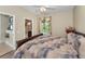 Bedroom featuring an ensuite bathroom and large window at 9208 Brindlewood Dr, Odessa, FL 33556