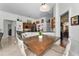 Open floor plan with dining area, bar seating and adjacent rooms for seamless entertaining and living at 9208 Brindlewood Dr, Odessa, FL 33556