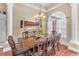 Bright dining room featuring a wooden table with seating and lots of natural light at 9208 Brindlewood Dr, Odessa, FL 33556