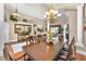 Dining room boasting an elegant wooden table, comfortable seating, and neutral decor at 9208 Brindlewood Dr, Odessa, FL 33556