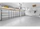 Spacious, well-lit garage with epoxy flooring, ready for parking and storage at 9208 Brindlewood Dr, Odessa, FL 33556