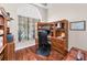 Spacious home office with custom built-ins and hardwood floors at 9208 Brindlewood Dr, Odessa, FL 33556