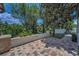 Well-manicured backyard with lush landscaping and a charming stone pathway at 9208 Brindlewood Dr, Odessa, FL 33556