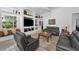 Spacious living room with neutral tones, built-in shelving, and a cozy window seat at 9208 Brindlewood Dr, Odessa, FL 33556