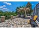 Inviting patio features an outdoor kitchen, gazebo, and an outdoor seating area at 9208 Brindlewood Dr, Odessa, FL 33556