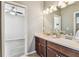Bathroom featuring double vanity sinks and stylish fixtures, creating a functional space at 9317 Bella Vita Cir, Land O Lakes, FL 34637