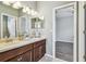 Bathroom featuring double sinks and ample counter space, ideal for a busy lifestyle at 9317 Bella Vita Cir, Land O Lakes, FL 34637