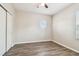 Bright bedroom with natural light, wood-look flooring, and a spacious closet at 9317 Bella Vita Cir, Land O Lakes, FL 34637