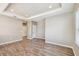 Light-filled bedroom has wood-look flooring and neutral walls, great for flexible living at 9317 Bella Vita Cir, Land O Lakes, FL 34637
