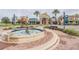 Club Connerton with decorative fountain, landscaping, and storefronts providing a welcoming community atmosphere at 9317 Bella Vita Cir, Land O Lakes, FL 34637