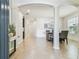 Spacious foyer with tile flooring, arched entryways, and an elegant dining area at 9317 Bella Vita Cir, Land O Lakes, FL 34637