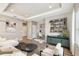 Cozy living room featuring modern decor and tray ceilings, perfect for relaxing and entertaining guests at 9317 Bella Vita Cir, Land O Lakes, FL 34637