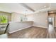 Upstairs loft space with lots of light, wood-look flooring, and a view of the outdoors at 9317 Bella Vita Cir, Land O Lakes, FL 34637