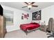 Standard bedroom with a bed, ceiling fan and window with blinds at 9734 Branching Ship Trce, Wesley Chapel, FL 33545