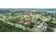 Aerial view of the condo complex, pool and mature trees at 9821 113Th St # 201, Seminole, FL 33772