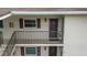 Apartment exterior featuring private porch access and updated details on exterior at 9821 113Th St # 201, Seminole, FL 33772