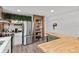 Stainless steel appliances, butcher block countertops and shelves in this open concept kitchen at 9821 113Th St # 201, Seminole, FL 33772