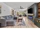 Cozy living room with an electric fireplace and lots of seating at 9821 113Th St # 201, Seminole, FL 33772