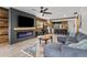A spacious living room with neutral colors and an electric fireplace at 9821 113Th St # 201, Seminole, FL 33772