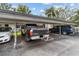 Covered parking area with multiple vehicles at 9821 113Th St # 201, Seminole, FL 33772