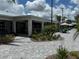 The clubhouse features outdoor seating, landscaping, and a covered area at 10098 Banyan Breeze Blvd, Land O Lakes, FL 34638