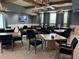 A gathering room with tables, chairs, and chandeliers for community members to enjoy at 10098 Banyan Breeze Blvd, Land O Lakes, FL 34638