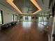 Spacious fitness room with mirrored walls, fitness balls, and ample natural light, perfect for workouts at 10098 Banyan Breeze Blvd, Land O Lakes, FL 34638