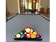 Pool table set up with colorful balls, ready for a game in a modern recreational space at 10098 Banyan Breeze Blvd, Land O Lakes, FL 34638