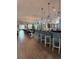 Bright restaurant featuring a bar, pendant lights, dining tables, and comfortable seating for a delightful experience at 10098 Banyan Breeze Blvd, Land O Lakes, FL 34638
