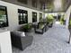This is a view of the clubhouse seating area with chairs, tables, and plants at 10098 Banyan Breeze Blvd, Land O Lakes, FL 34638