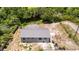 High-angle view revealing the back of the home and the property's waterfront and wooded setting at 11009 Spivey Rd # 1, Gibsonton, FL 33534