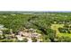Panoramic aerial view showcasing the property's proximity to a winding creek and natural surroundings at 11009 Spivey Rd # 1, Gibsonton, FL 33534