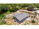 Elevated shot showing home's back, revealing a peaceful creekside setting with ample greenery and space at 11009 Spivey Rd # 1, Gibsonton, FL 33534