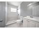 Renovated bathroom featuring walk-in shower and modern vanity with tile flooring at 11009 Spivey Rd # 1, Gibsonton, FL 33534