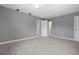 Bedroom features neutral paint, tile flooring, and multiple doors for easy access at 11009 Spivey Rd # 1, Gibsonton, FL 33534