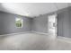 Bright open bedroom with neutral paint, tile floors, ceiling fan and natural light at 11009 Spivey Rd # 1, Gibsonton, FL 33534