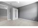 Bedroom features tile floors, neutral paint, ceiling fan and built-in wardrobe at 11009 Spivey Rd # 1, Gibsonton, FL 33534