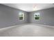 Large bright bedroom features fresh paint, ceiling fan and two windows with beautiful green views at 11009 Spivey Rd # 1, Gibsonton, FL 33534