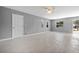 Bright open living room with tile floors, natural light, and neutral paint at 11009 Spivey Rd # 1, Gibsonton, FL 33534
