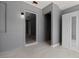 This room features tile floors, fresh paint and a large door frame to another room at 11009 Spivey Rd # 1, Gibsonton, FL 33534