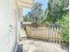 Backyard with wood fence and a view of a towering palm tree shows a great place for entertaining at 1221 E Hamilton Ave, Tampa, FL 33604